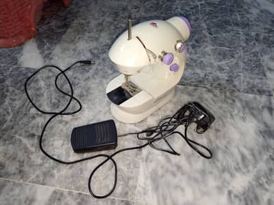 Mini Sewing Machine Brand New.