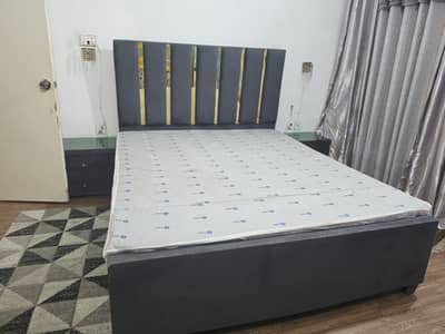 Grey Wooden Bed with side table.