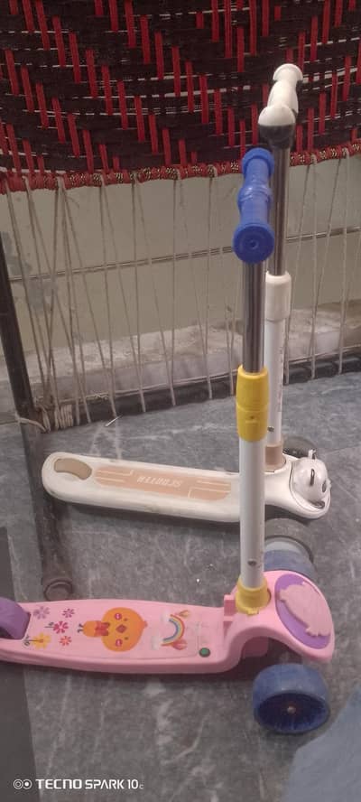 2 kids scooties good condition with music