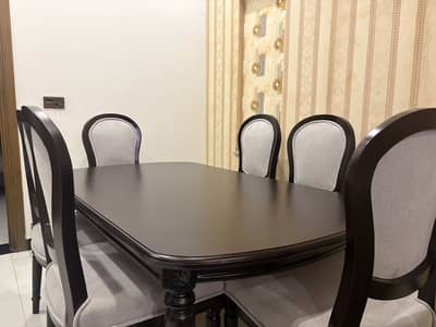 Brand new six chairs dining table in bouqle fabric