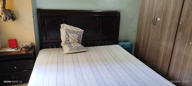 Double bed with mattress.