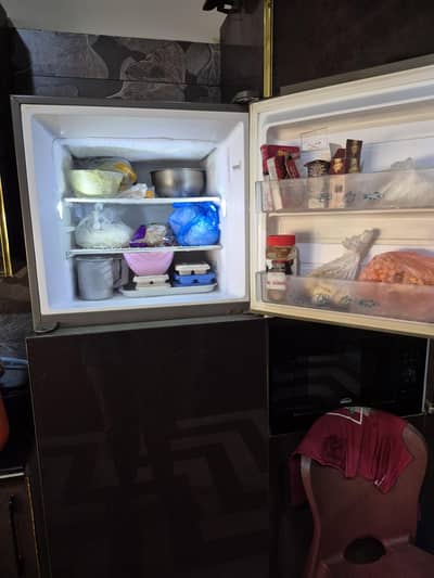 Glass door Full size refrigerator with touch buttons. Good condition.
