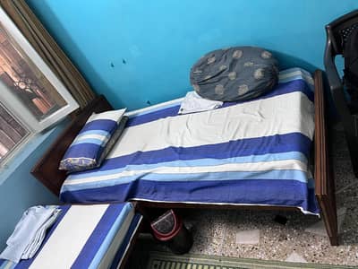 Single wooden bed for sale