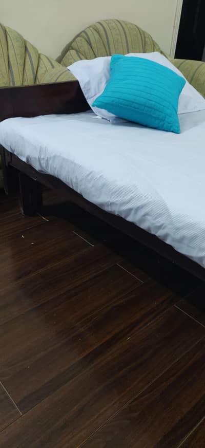 original black Tali wooden bed with mattress