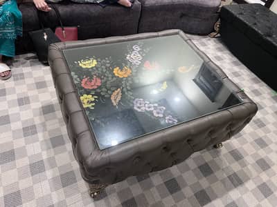big square centre table with handpainted glass top.