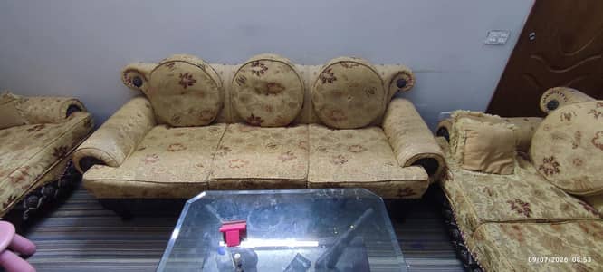 7 Seater sofa set in good condition with glass table