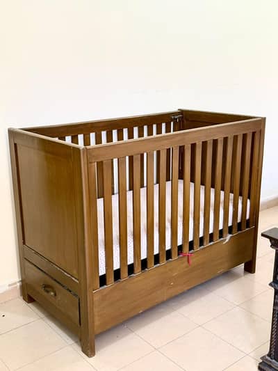 Wooden babycot.