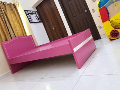kids bed and mattress and toy rack. . .