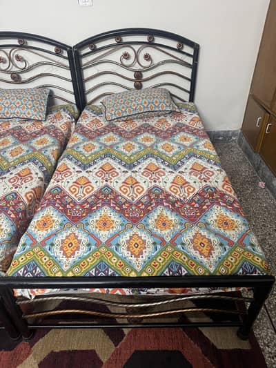 Pair of single Iron Rods Beds
