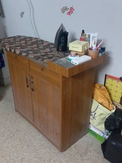 Iron stand with cupboard and drawer