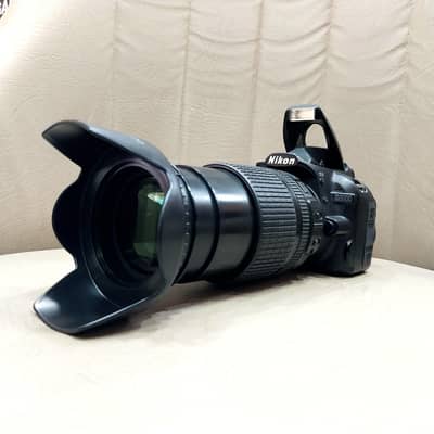 Nikon D3100 DSLR Camera with Nikon 18-135 mm zooming lens