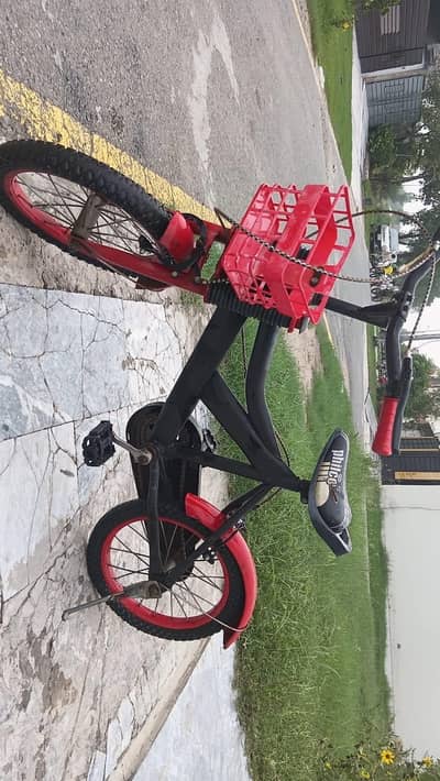 red and black kids cycle