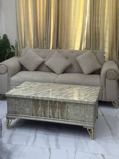 3 2 1 beige sofa set and a centre table