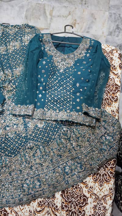 hand made bridal lehenga in mungiya color