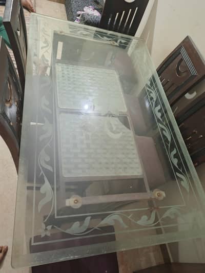 Wooden dining table with 6 chairs. good condition.