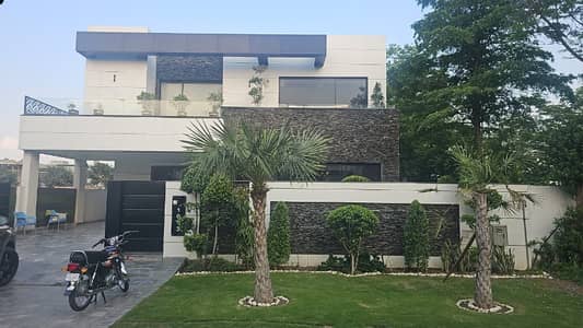 SYED BROTHERS PROUDLY OFFERS: 1-Kanal Elegant And Fully Maintained Modern Brand New Bungalow With 2 Servant Quarter In Basement Is Available In The Best Block Of DHA Lahore.