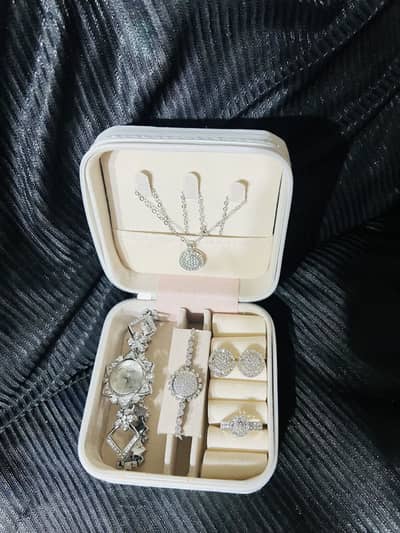 Silver colour artificial jewellery with analog watch last piece left
