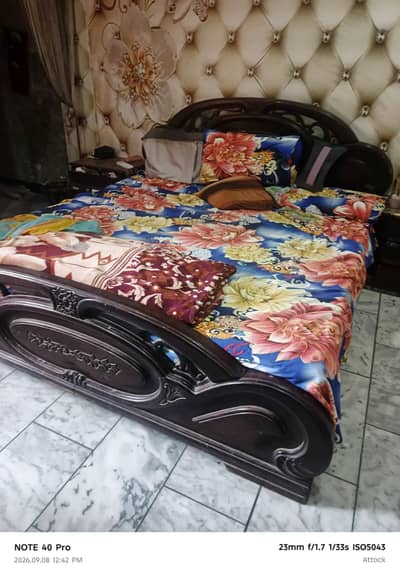 king size bed with 2 side tables and one dressing table