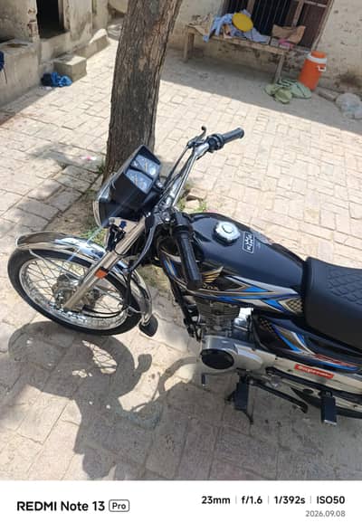 Honda 125 with golden number