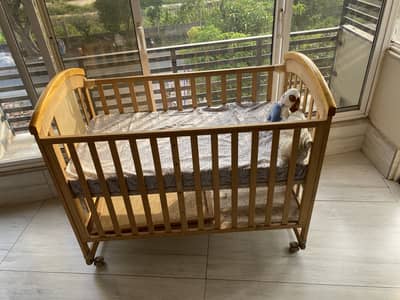 Wooden baby cot with mattress for sale