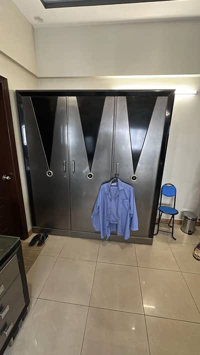 3 door and 2 door black and grey cupboard.