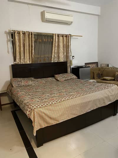 King size wooden bed with mattress