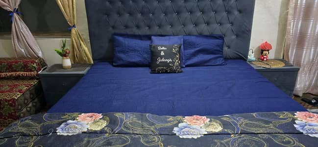 King size bed for sale with wardrobes and mattress.