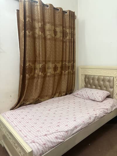 Single bed with dressing table and two shelves