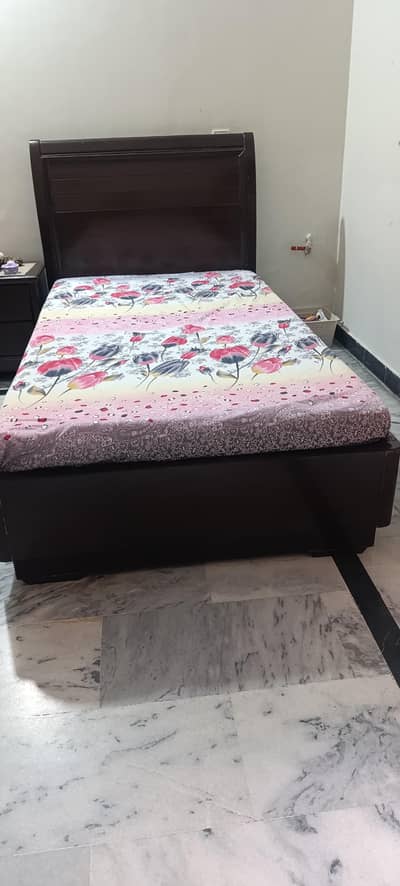 two single beds with side table
