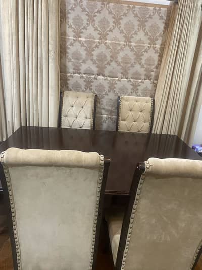 Wooden dining table with chairs