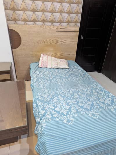side bed with side table and dressing table