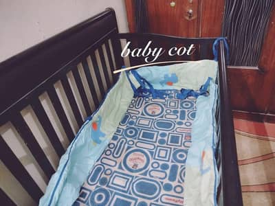 branded baby cot in good condition