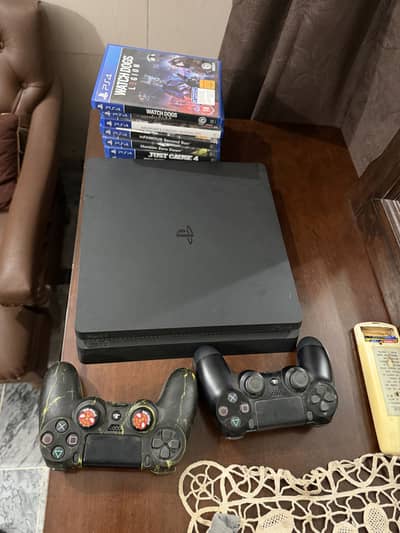 Ps4 Slim 1tb version with controllers and games