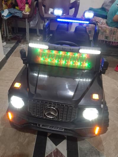 kid charging car with remote and charger