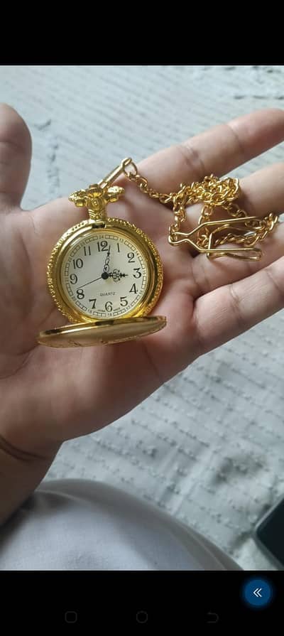 golden quartz pocket watch