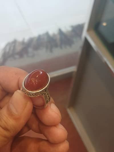 Aritificial ring but a real stone aqeeq