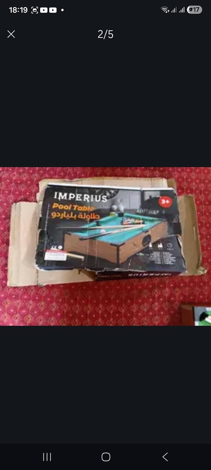 This is a small Pool Table Which has one ball missing 1