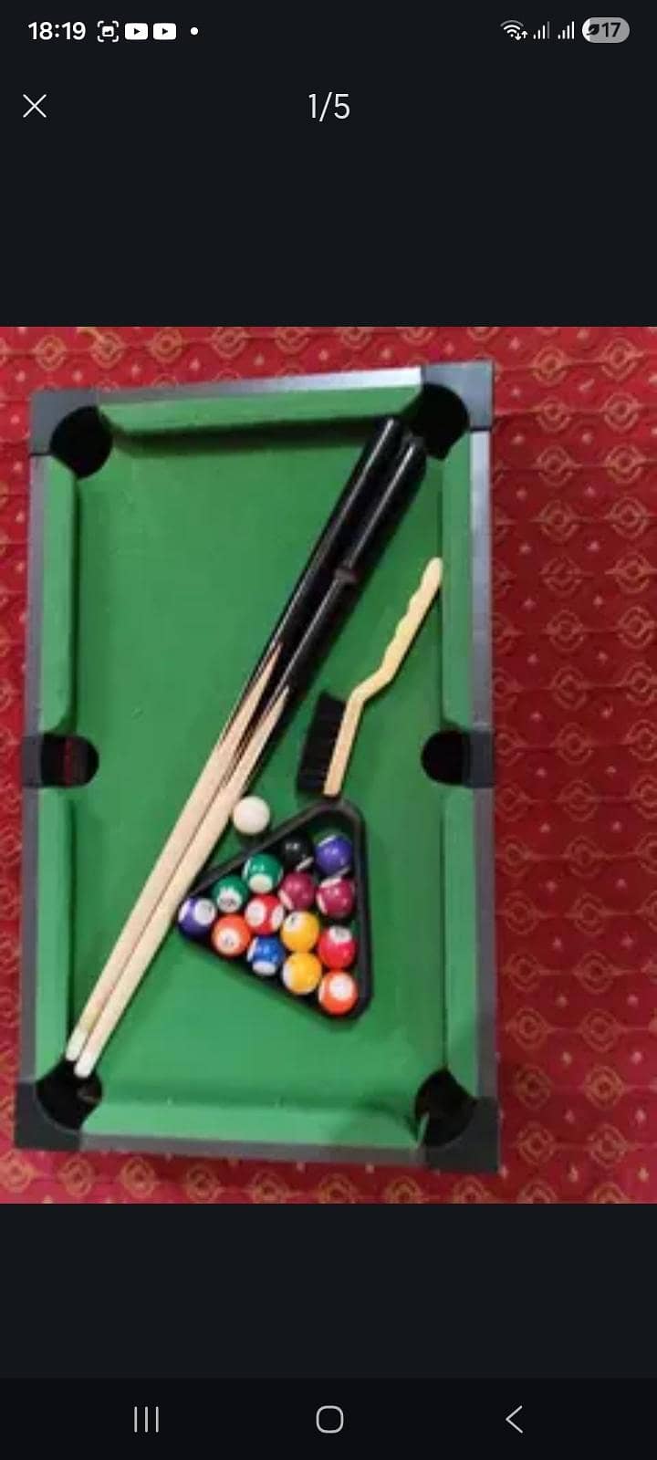 This is a small Pool Table Which has one ball missing 2