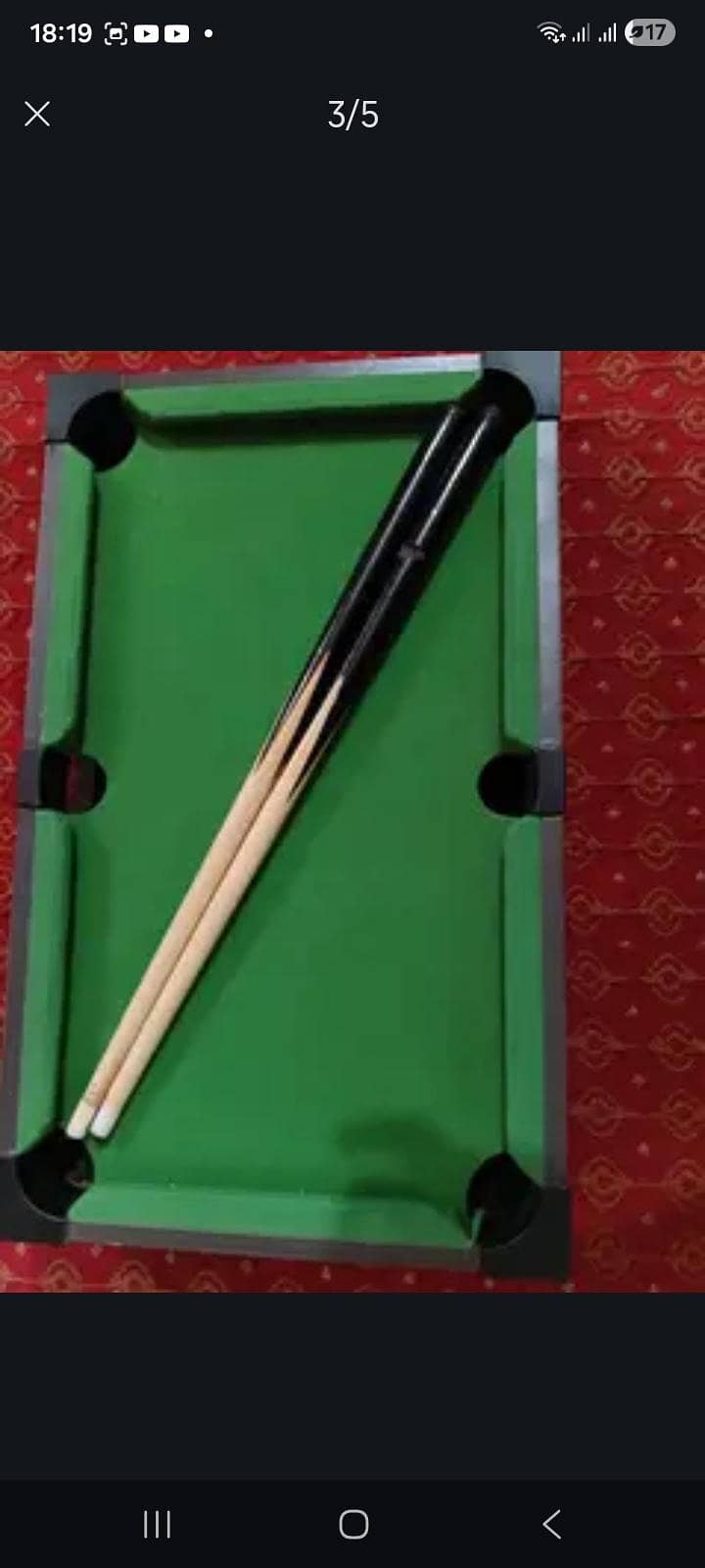 This is a small Pool Table Which has one ball missing 3