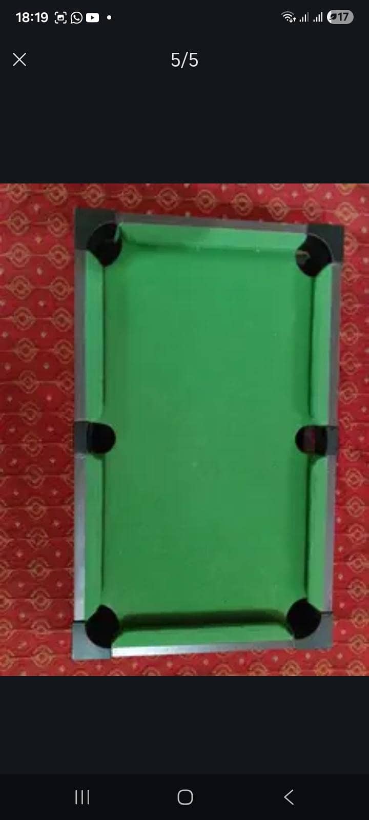 This is a small Pool Table Which has one ball missing 5