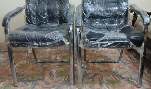 two office chairs new condition on 3 months used in office