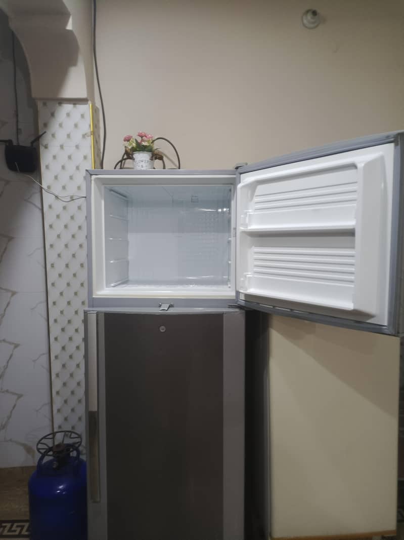 two medium sized refrigerators 1