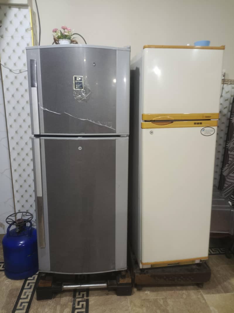 two medium sized refrigerators 3