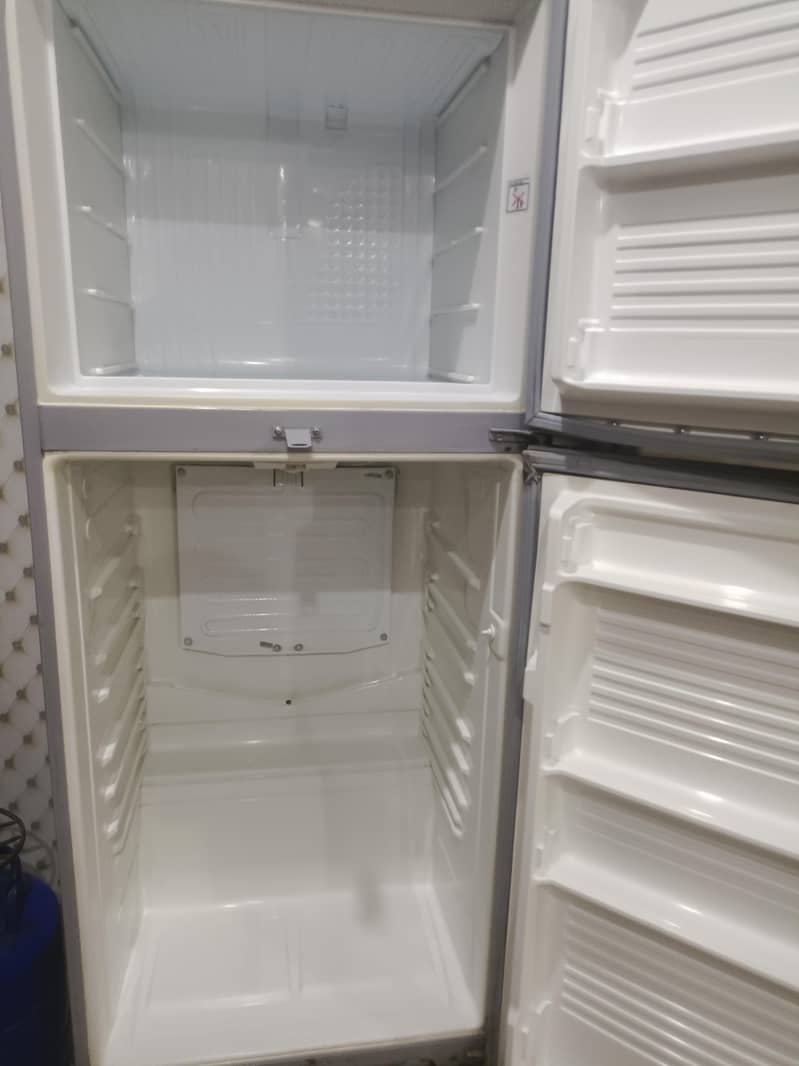 two medium sized refrigerators 4