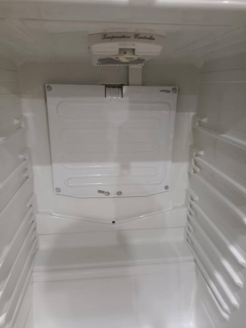 two medium sized refrigerators 5