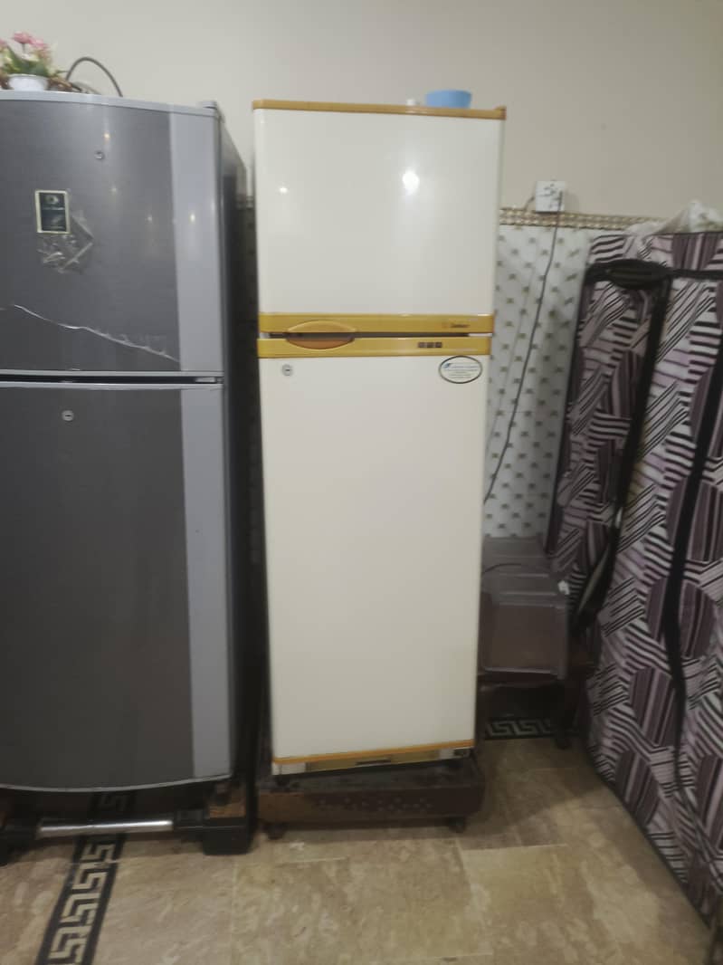 two medium sized refrigerators 8