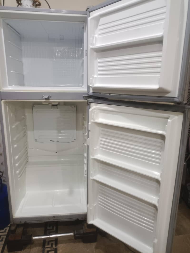 two medium sized refrigerators 9