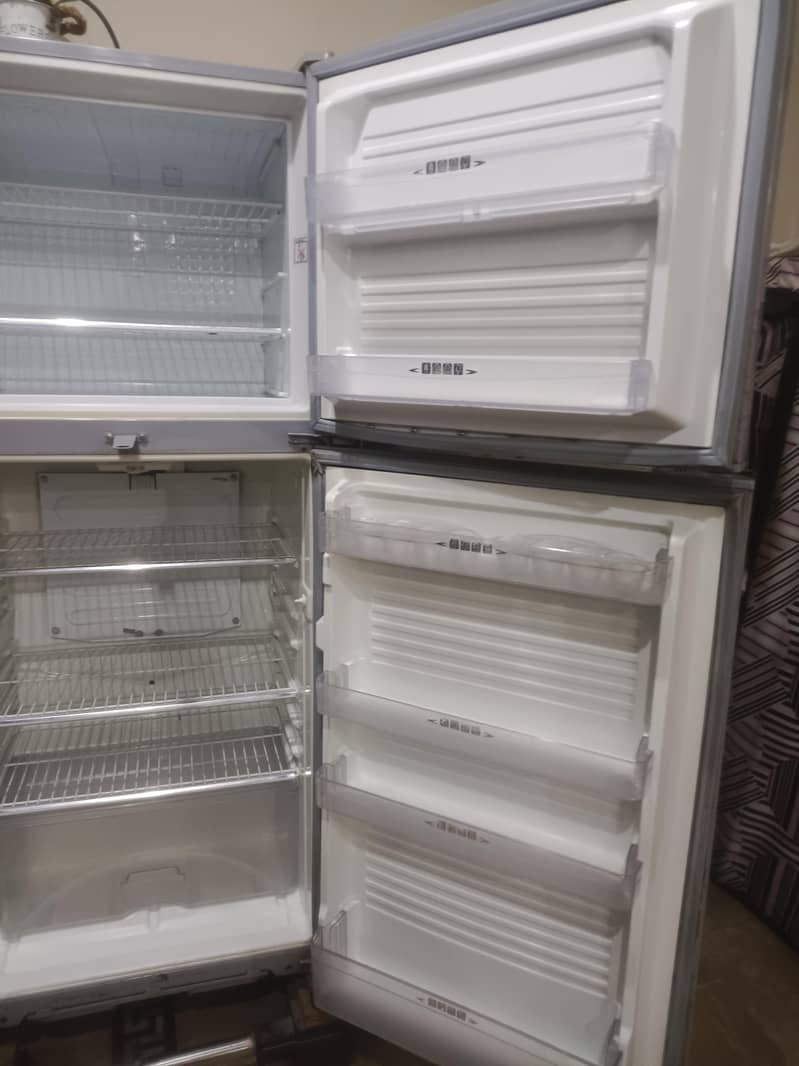 two medium sized refrigerators 11