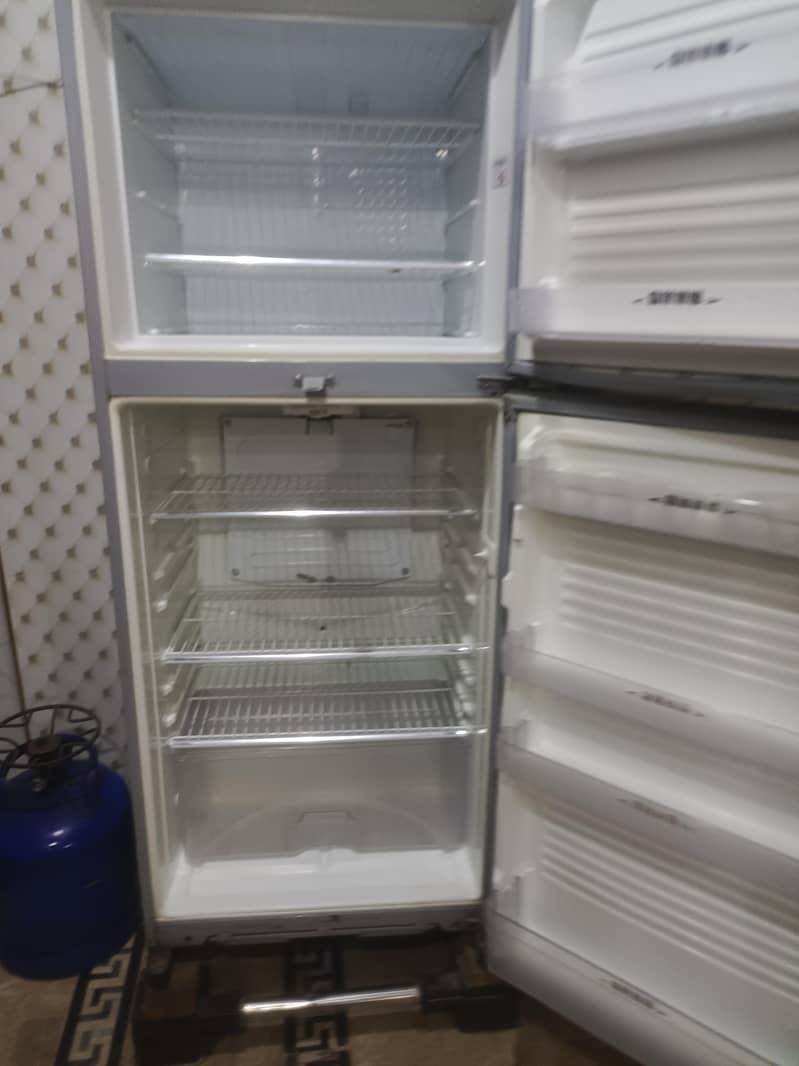 two medium sized refrigerators 12