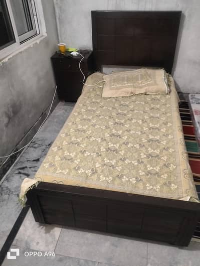 single bed with mattress and 1 side table